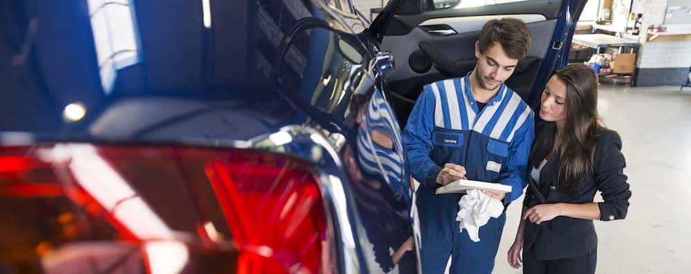 Mechanic Going Over Checklist