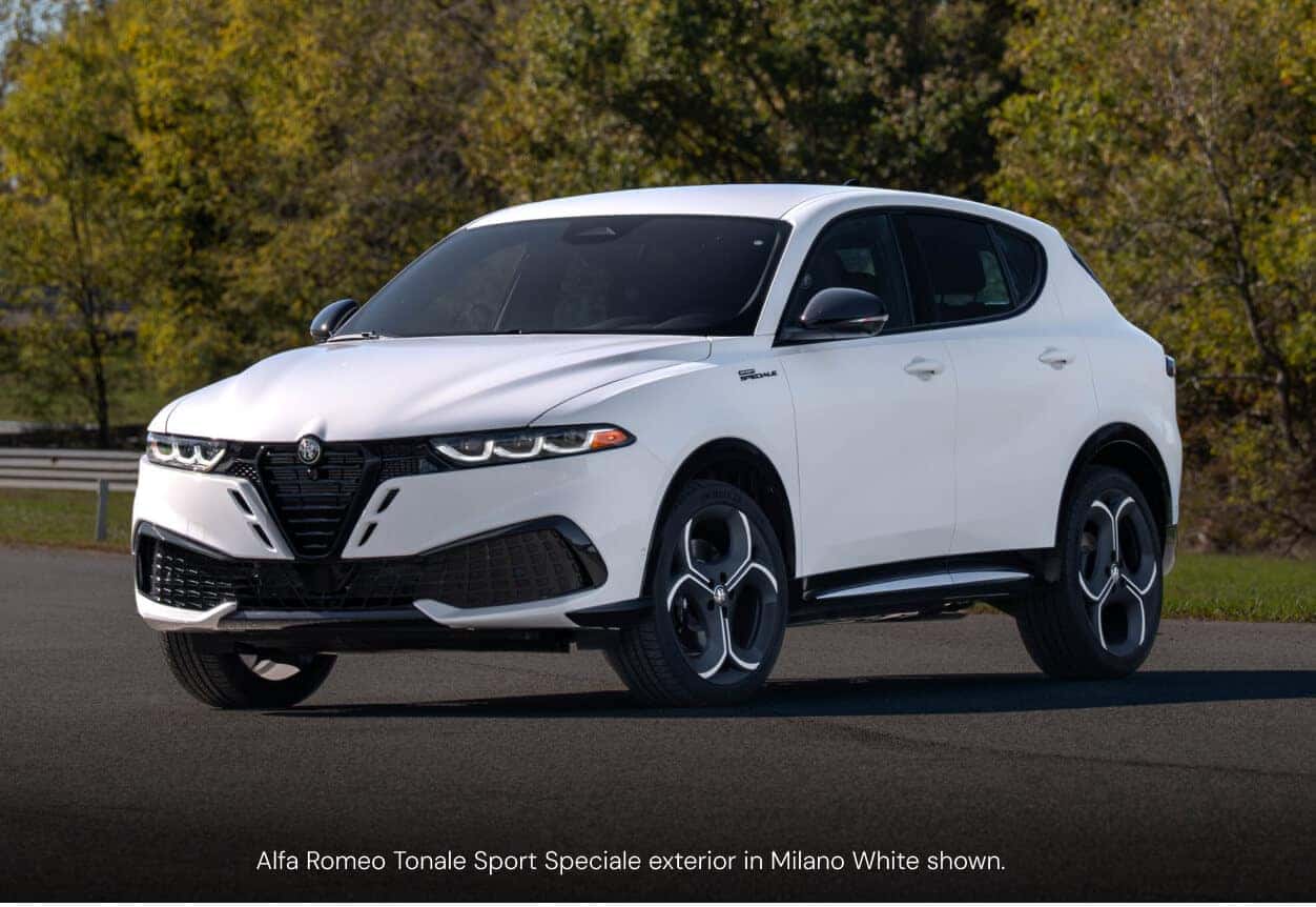 Three-quarter front view of an Alfa Romeo Tonale Sport Speciale in Milano White parked on an asphalt track.