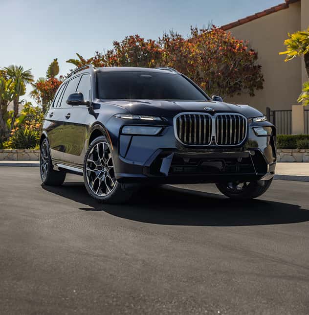 BMW SUV driving on road