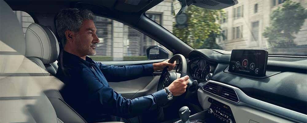 Man driving a Mazda CX-9