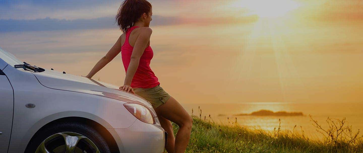 Woman Sitting On Car