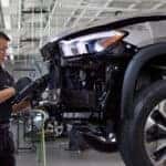 Mercedes-Benz service technician inspecting a vehicle