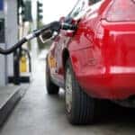 Pumping gas into a red car