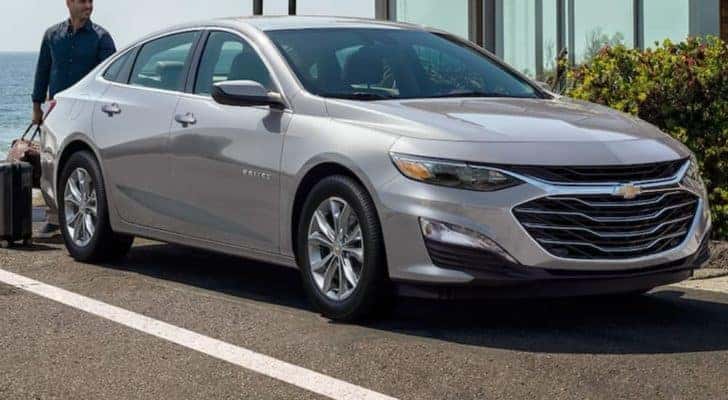 A silver 2021 Chevy Malibu is shown from the front.