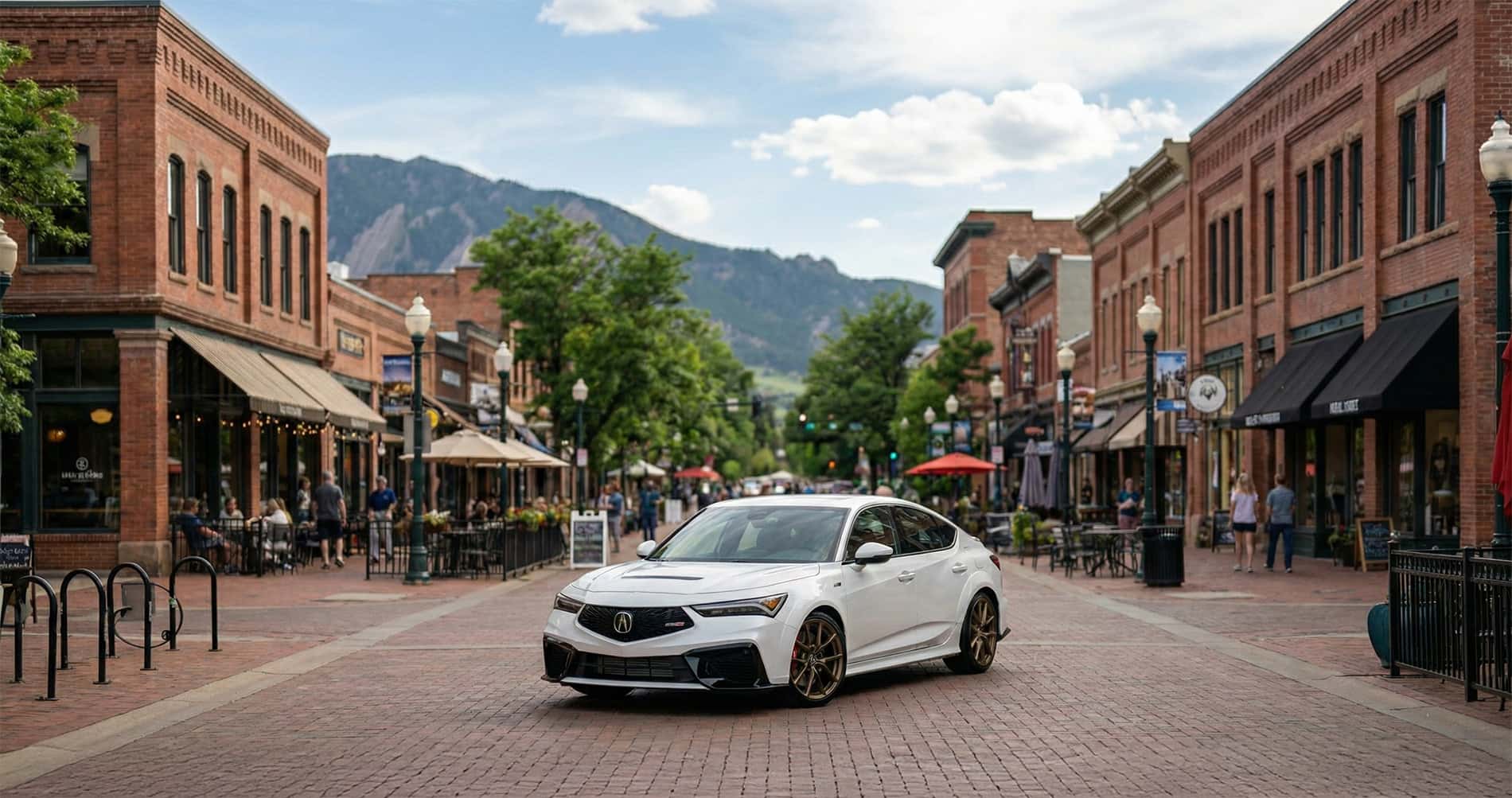 Acura Integra in white parked on Pearl Street in Boulder, Colorado