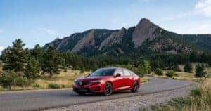 2026 Acura Integra parked on a scenic road near the Flatirons in Boulder, Colorado, highlighting sporty design and everyday practicality