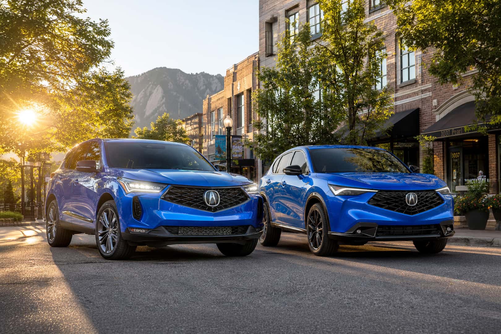 2026 Acura RDX and ADX parked in downtown Boulder at sunrise