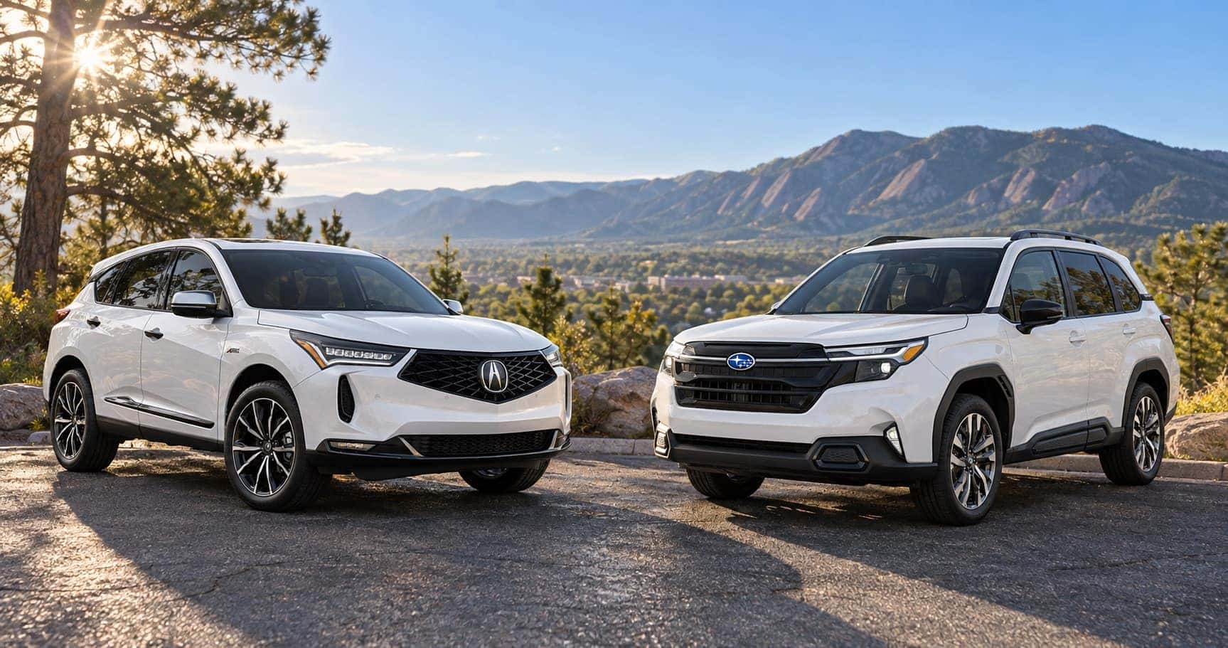 2026 Acura RDX and 2026 Subaru Forester with Boulder, CO mountains in the background