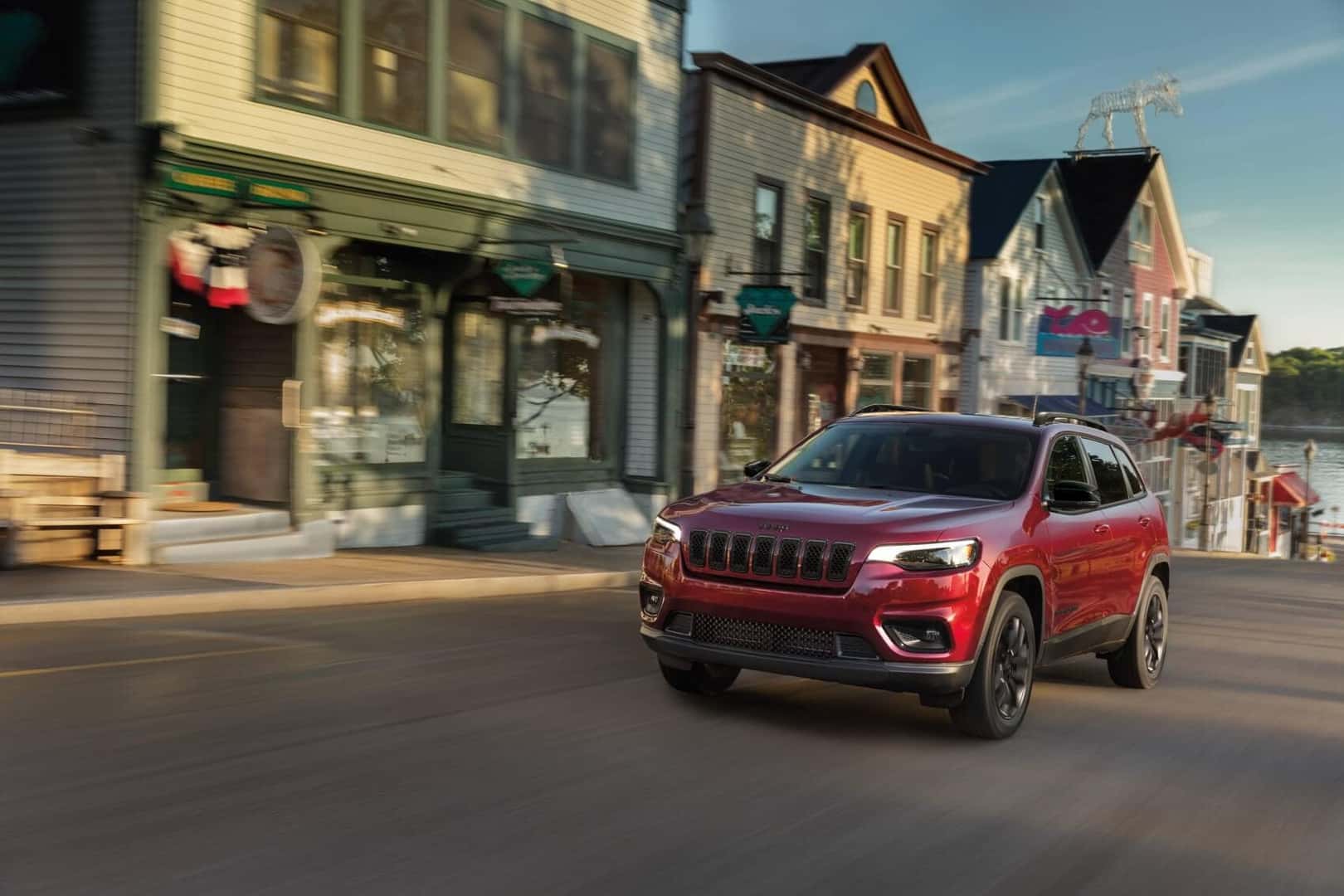 Red Jeep Cherokee Test Drive Through Town
