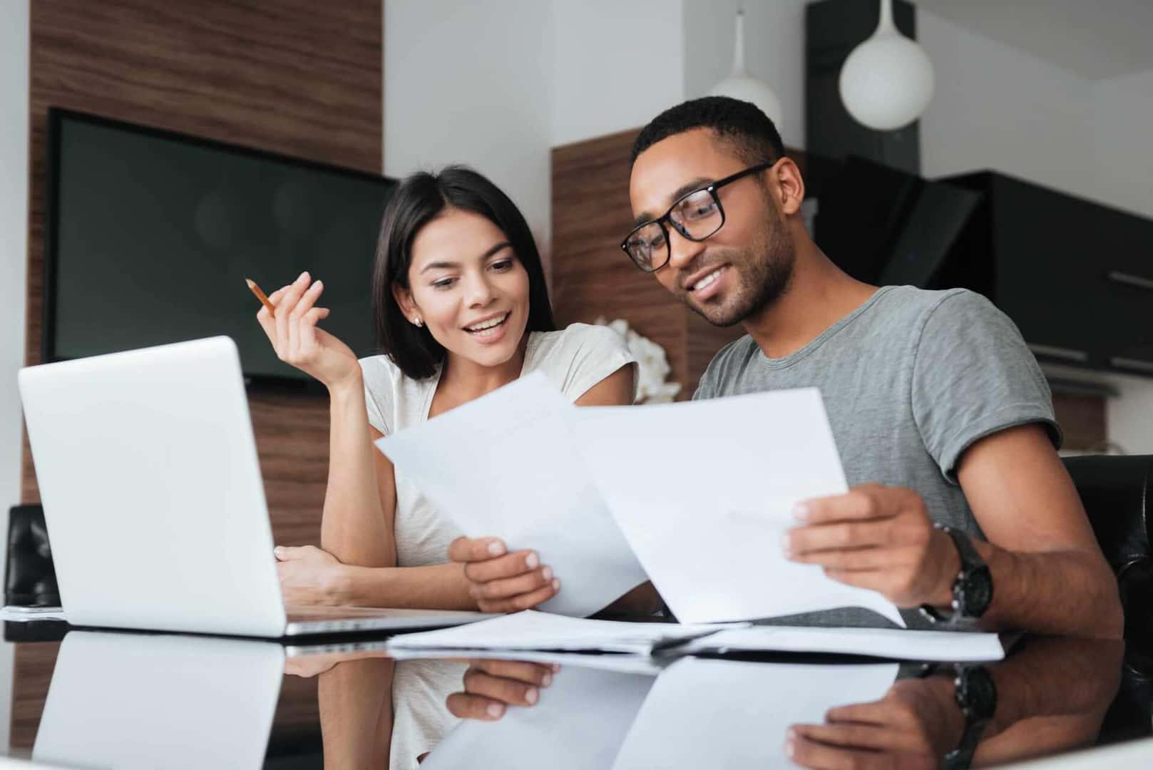 A YoungCouple Looking Through Financial Documents