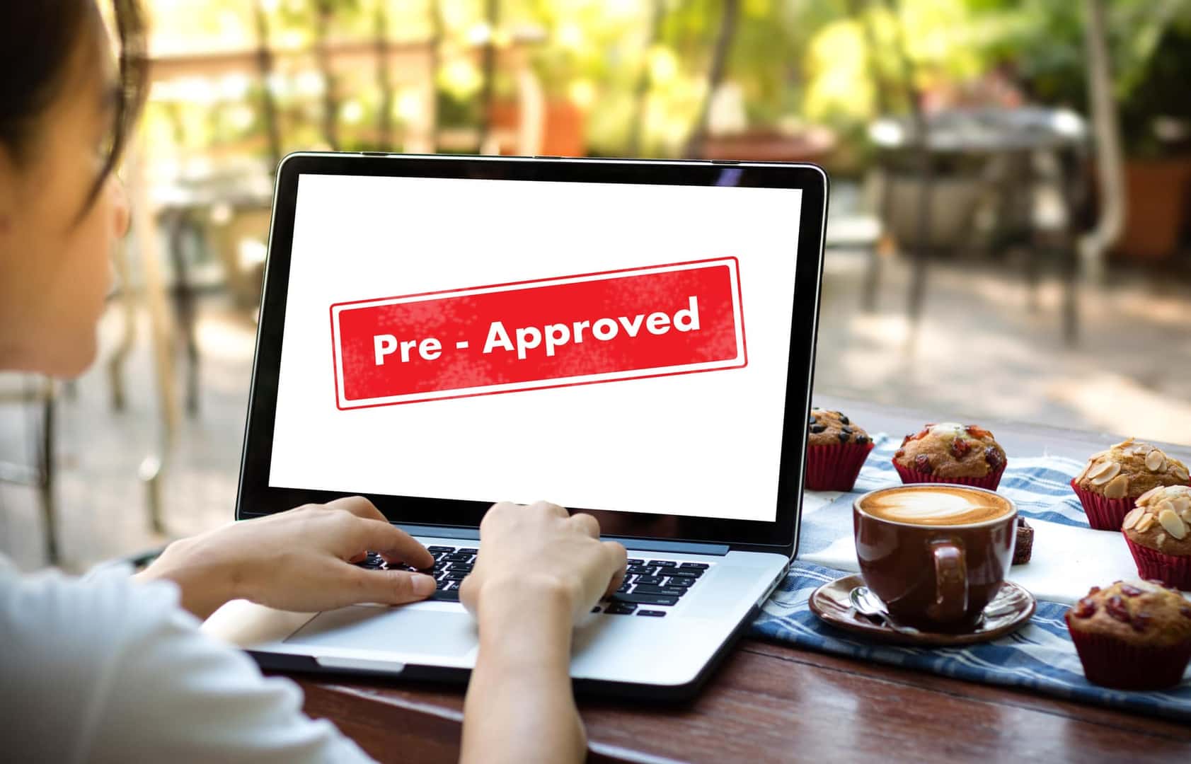 Young Woman Getting Pre Approved on her Laptop