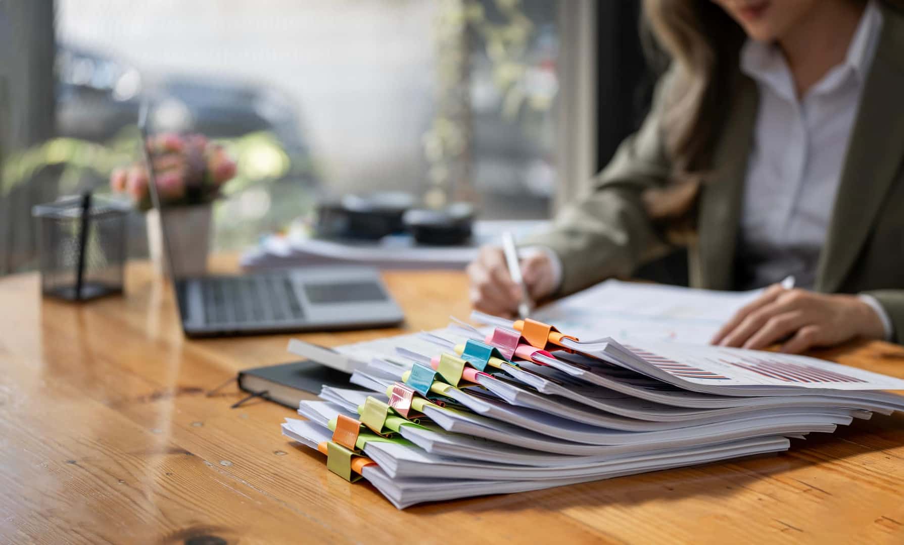 Woman with organized files and papers