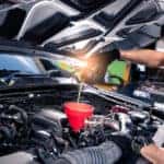 a-mechanic-changing-the-oil-in-a-car