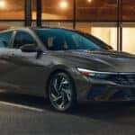 2024 Hyundai Elantra Hybrid parked in front of a building during the evening