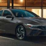 2024-Elantra-Hybrid-parked-in-front-of-an-establishment