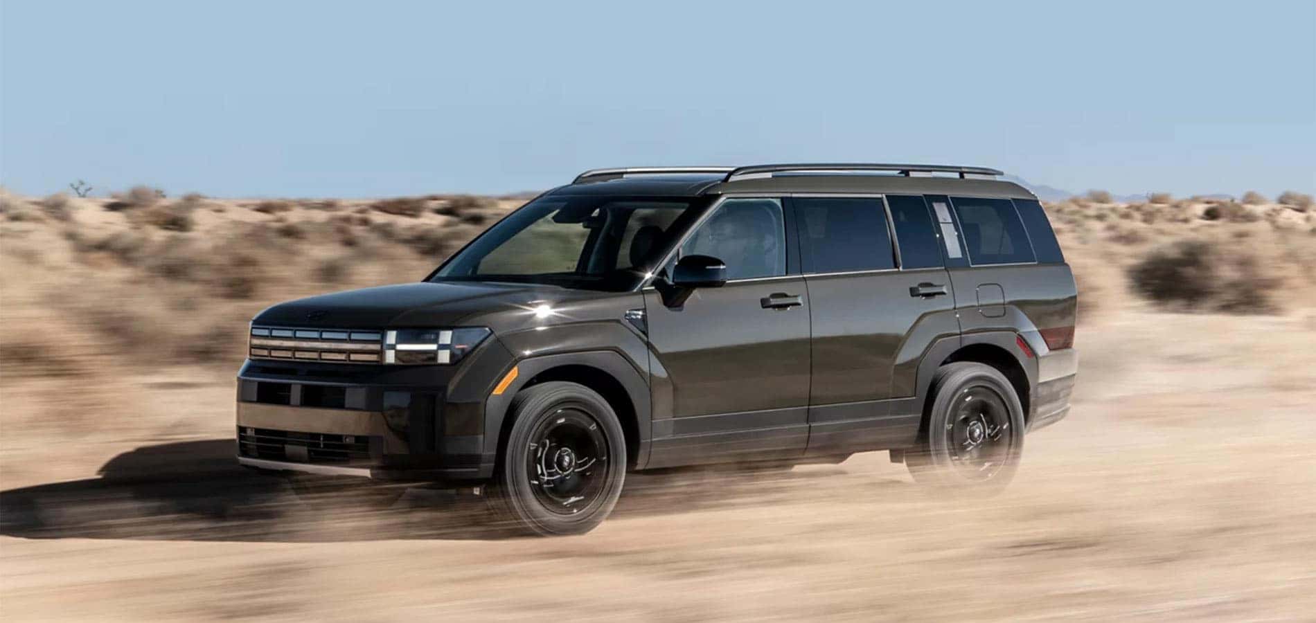 2025 Hyundai Santa Fe driving through the desert