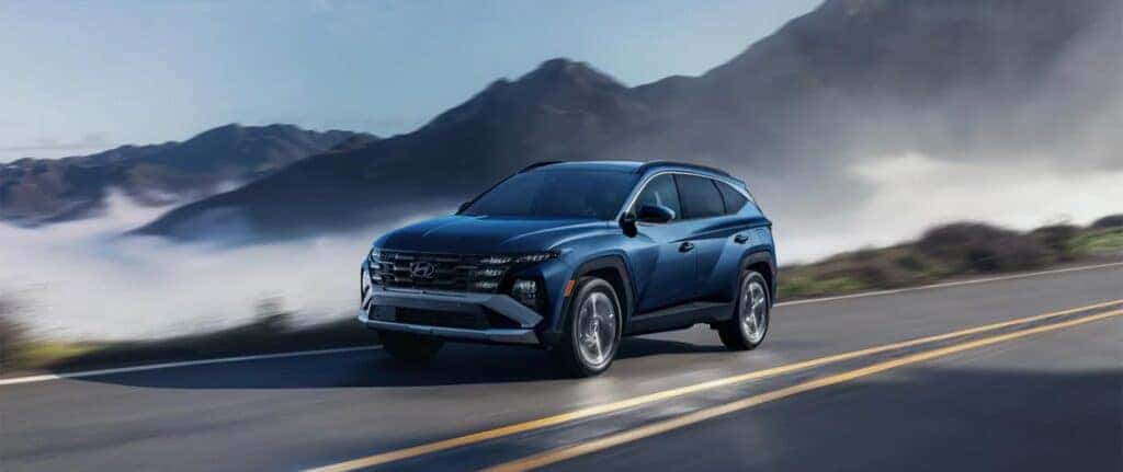 2026 Hyundai Tucson on the road in a mountainous setting
