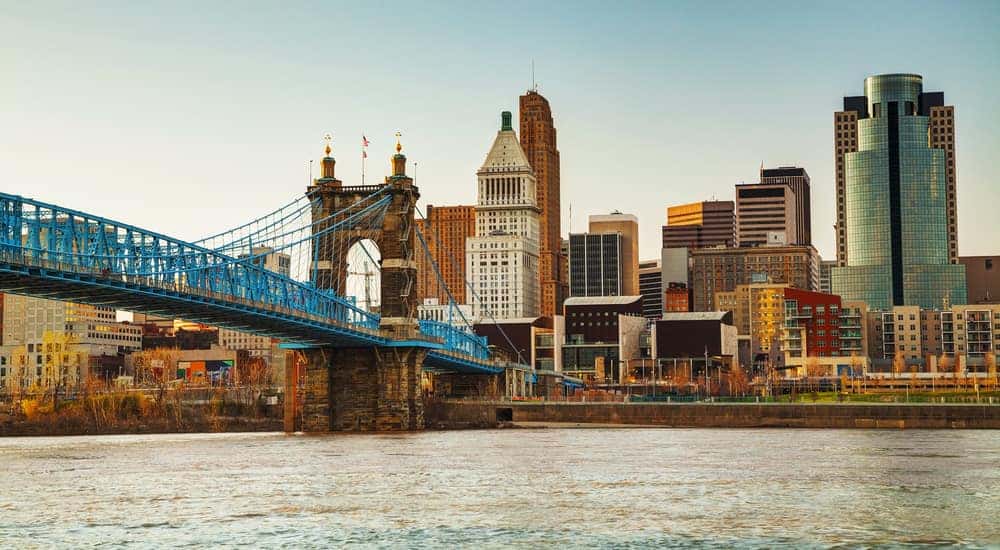 Water, a bridge, and tall Cincinnati buildings in the daylight
