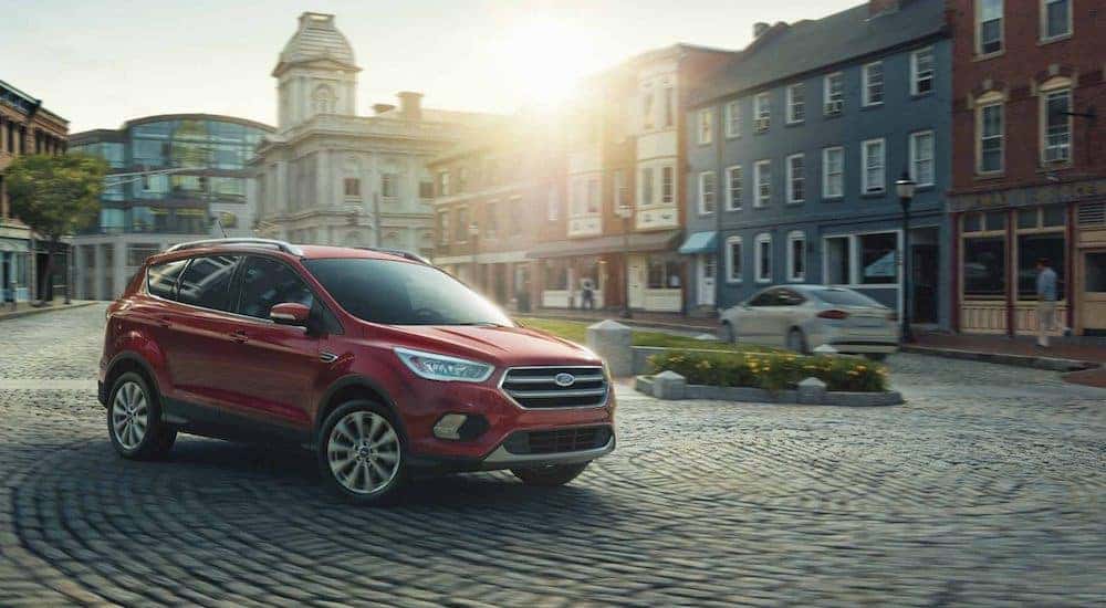 Red 2018 Ford Escape on cobblestone street