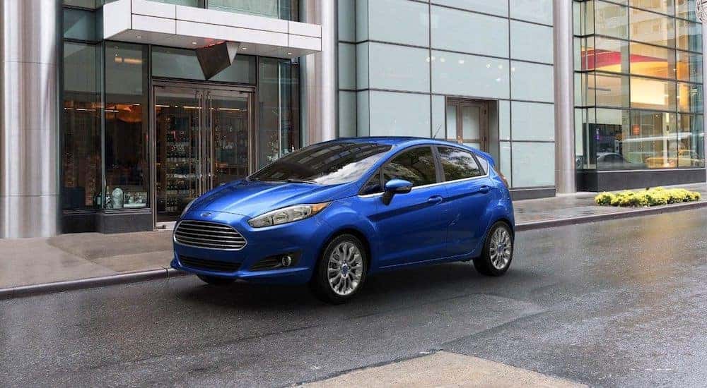 Blue 2018 Ford Fiesta in front of city store