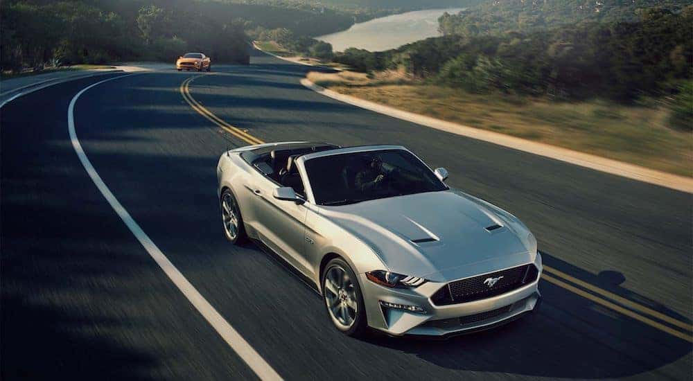 Silver 2018 Ford Mustang on highway in hills