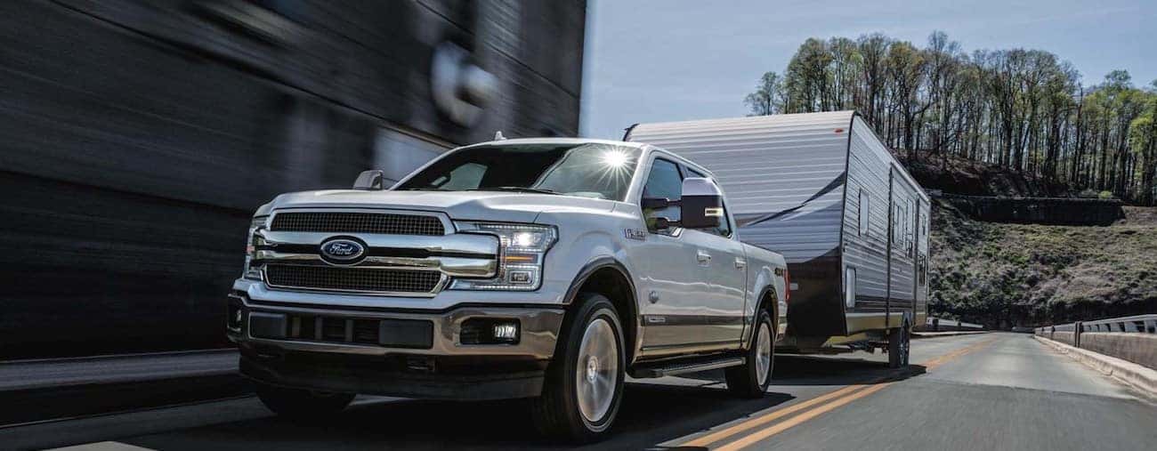 A 2019 Ford F-150 towing a large RV