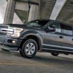 A black 2018 Used Ford F150 under a bridge
