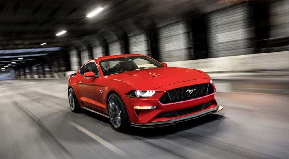 A red 2019 Mustang races through a tunnel from Ford Dealers in Ohio