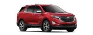 A red 2019 Chevy Equinox is facing right.