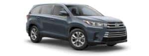 A blue 2019 Toyota Highlander is facing right.