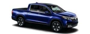 A blue 2019 Honda Ridgeline is facing right.