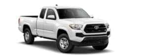 A white 2019 Toyota Tacoma is facing right.