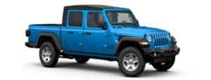 A blue 2020 Jeep Gladiator is facing right.