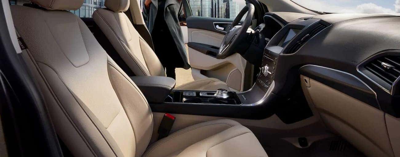 The tan interior of a 2019 Ford Edge, which wins when comparing the 2019 Ford Edge vs. 2019 Hyundai Santa Fe, is shown.