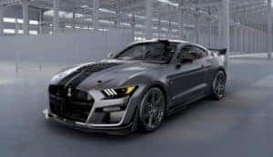 A grey Venom edition 2020 Shelby GT500 is in a warehouse.