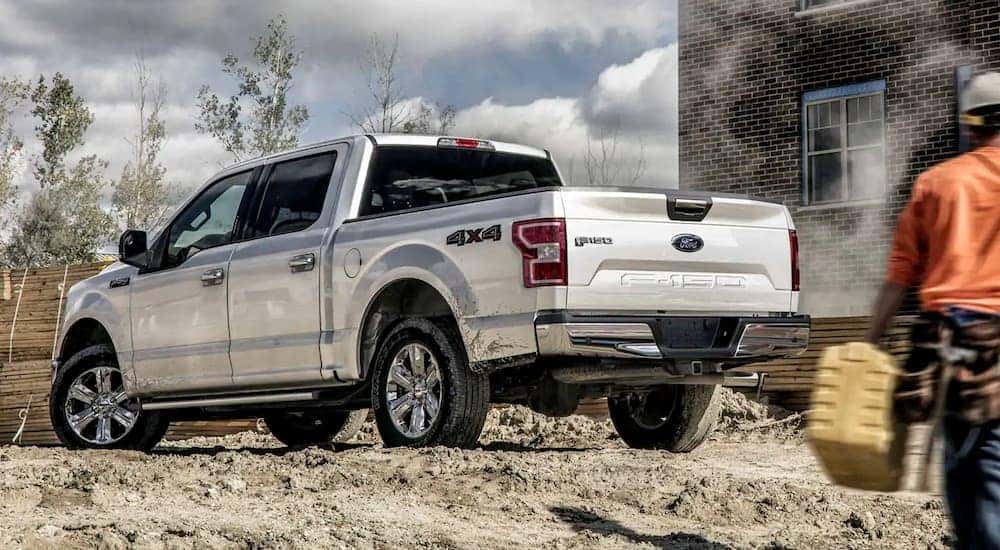 A white 2019 Ford F-150 is at a construction site in Cincinnati, OH.