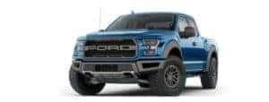 A blue 2019 Ford Raptor is facing left.