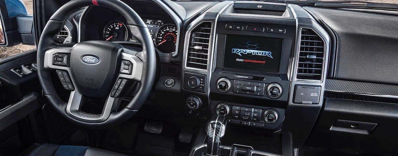 The black interior of a 2019 Ford Raptor is shown in Cincinnati, OH.