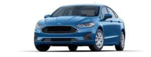 A blue 2019 Ford Fusion is facing left.