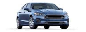A blue 2019 Ford Fusion is facing right.
