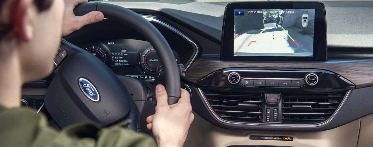 A close up the dash and infotainment system inside a 2020 Ford Escape is shown.