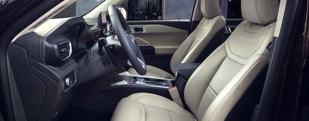 The front tan leather interior of a 2020 Explorer is shown. 