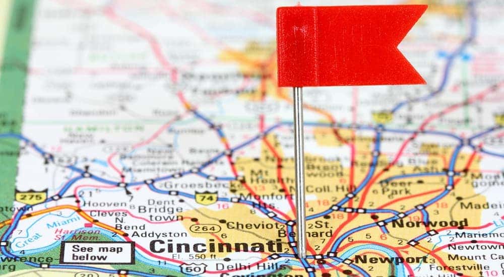 A map of Cincinnati, OH, is shown with a red flag marking it. 