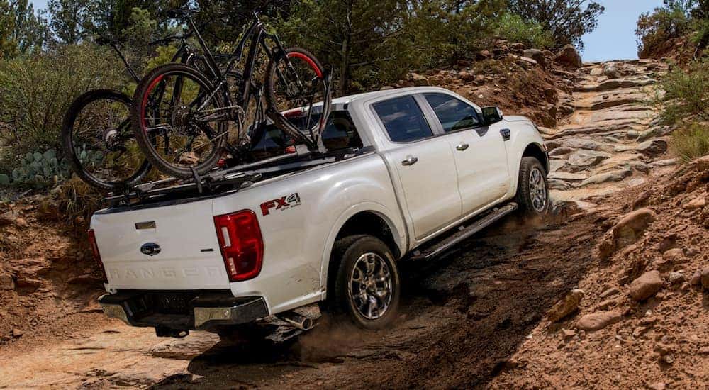 A white 2020 Ford Ranger, which is a popular option among used Fords for sale, is off-roading near Cincinnati, OH.