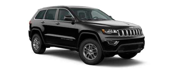A black 2020 Jeep Grand Cherokee is facing right.