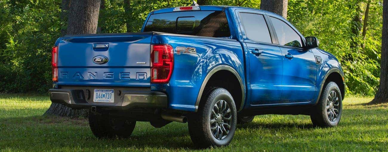 A blue 2020 Ford Ranger FX2 is shown from the rear on grass near Cincinnati, OH.