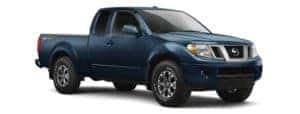 A blue 2020 Nissan Frontier is facing right.