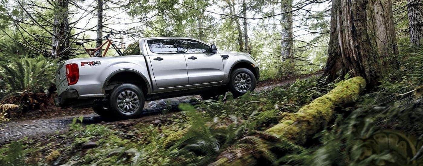 A silver 2020 Ford Ranger is off-roading in the woods near Cincinnati, OH.
