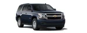 A blue 2020 Chevy Tahoe is angled right.