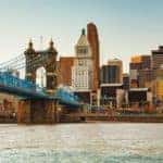 The skyline and bridge of Cincinnati, OH, is shown.